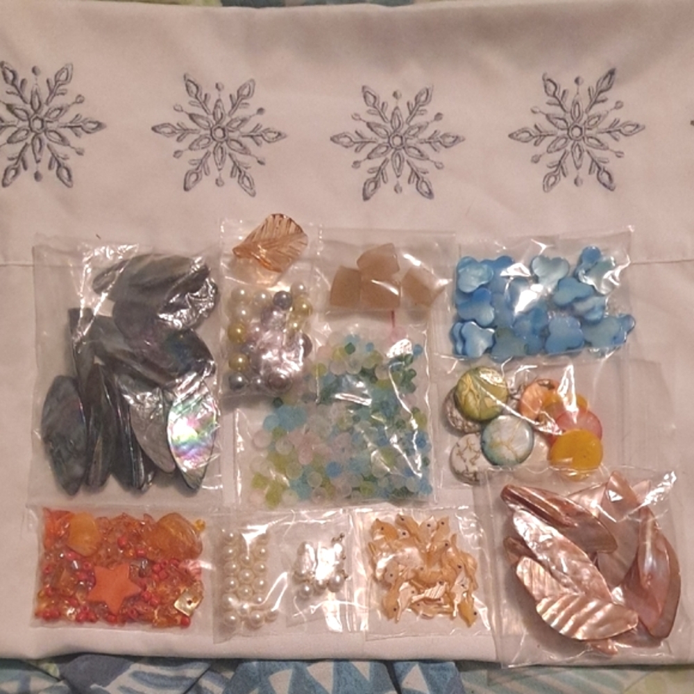 Assorted natural craft beads: pearls and shells